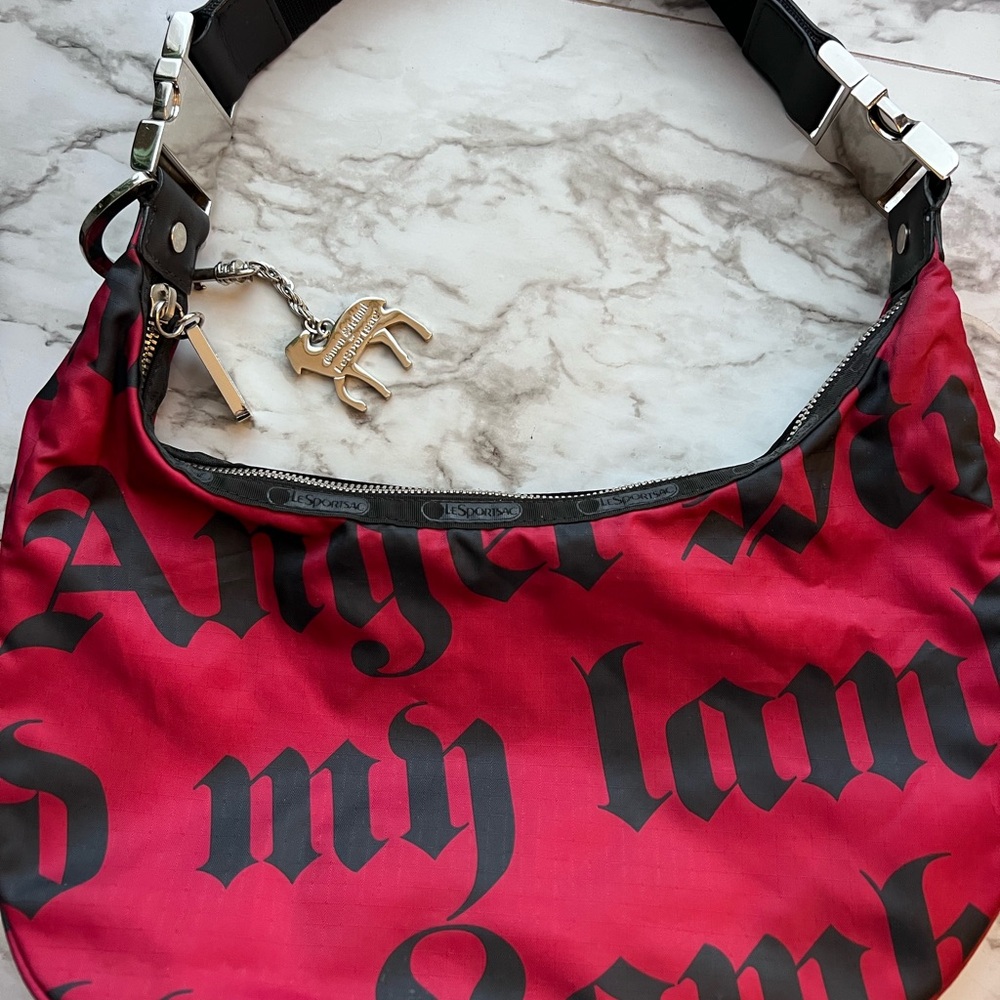 Red and Black Crescent Shoulder Bag with Gothic Text